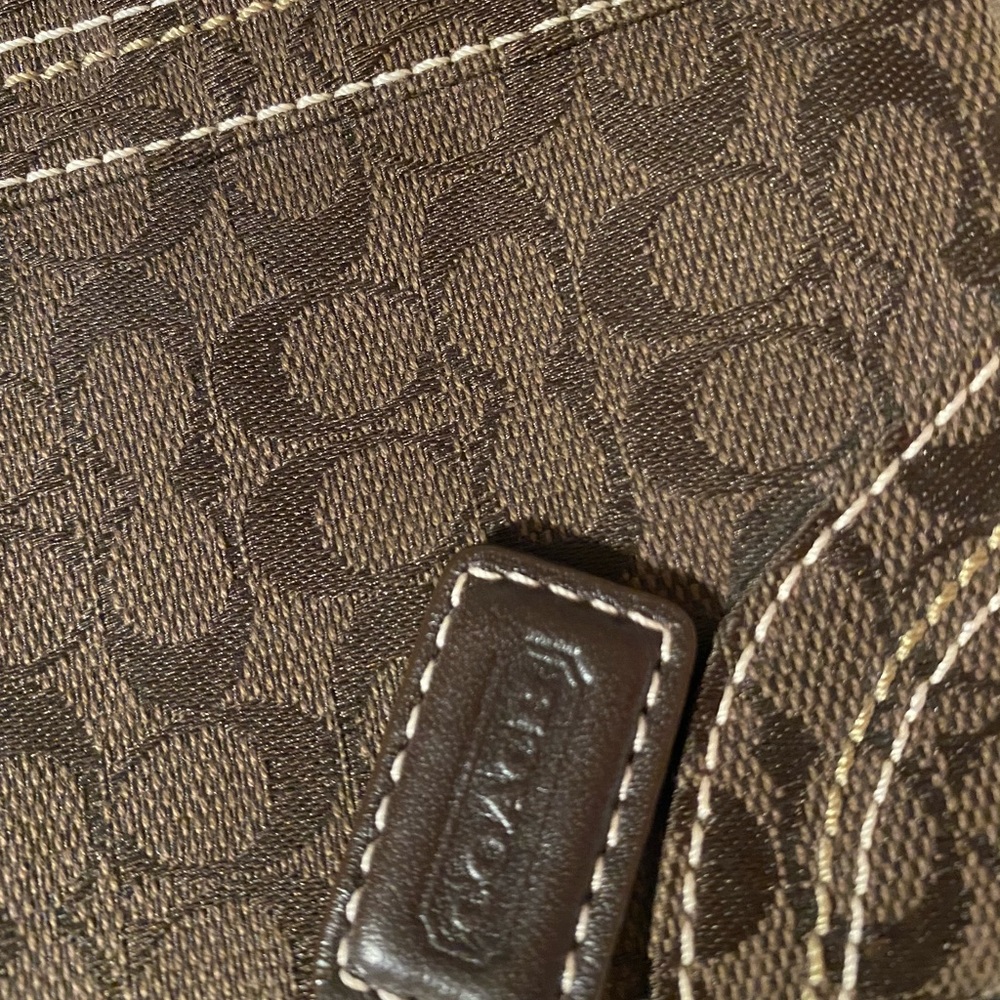 Traditional brown Coach wristlet.